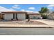 Charming single-story brick home with a tile roof and desert landscaping in a well-maintained neighborhood at 5141 E Elena Ave, Mesa, AZ 85206
