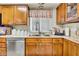 The kitchen sink and dishwasher sit below a window that provides natural light at 5141 E Elena Ave, Mesa, AZ 85206