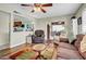 A cozy living room with hardwood floors, comfortable seating, and an open layout to the dining area at 5141 E Elena Ave, Mesa, AZ 85206
