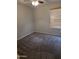 Comfortable bedroom featuring neutral walls, soft carpeting, and natural light from a window at 5501 S Dove Crk Crk, Buckeye, AZ 85326