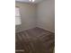 Bedroom with plush carpet, a window with blinds, and a ceiling fan at 5501 S Dove Crk Crk, Buckeye, AZ 85326