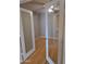 Comfortable bedroom with hardwood floors, ceiling fan, natural light, and neutral-colored walls at 5501 S Dove Crk Crk, Buckeye, AZ 85326