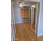 Cozy bedroom with hardwood floors, ceiling fan, and a window with wood blinds at 5501 S Dove Crk Crk, Buckeye, AZ 85326