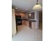 Bright kitchen showcasing black appliances, light wood cabinets, and ample counter space at 5501 S Dove Crk Crk, Buckeye, AZ 85326