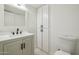 Bright bathroom with updated vanity, light fixtures, and a mirrored cabinet for extra storage at 6173 N Granite Reef Rd, Scottsdale, AZ 85250
