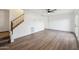 Spacious living area with wood-look floors and a staircase leading to the upper level at 6173 N Granite Reef Rd, Scottsdale, AZ 85250