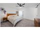 Bedroom with ceiling fan and sliding barn door entryway to hallway at 646 W Yale Dr, Tempe, AZ 85283