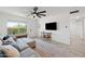 Bright living room featuring a ceiling fan, and wood-look floors at 646 W Yale Dr, Tempe, AZ 85283