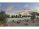 Modern home exterior with lush landscaping and a white facade that blends seamlessly with the natural surroundings at 6601 E San Miguel Ave, Paradise Valley, AZ 85253