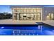 Modern home showcasing large windows and a sleek pool, creating an inviting indoor-outdoor living space at 6601 E San Miguel Ave, Paradise Valley, AZ 85253