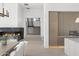 Hallway featuring stairs, modern fireplace, light hardwood floors and high ceilings at 6601 E San Miguel Ave, Paradise Valley, AZ 85253