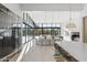 Large open concept kitchen and living space featuring wine storage, island seating, and mountain views at 6601 E San Miguel Ave, Paradise Valley, AZ 85253
