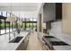 Open-concept kitchen with island and modern appliances offering seamless integration with the living space at 6601 E San Miguel Ave, Paradise Valley, AZ 85253