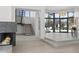 Spacious living area with a modern fireplace and open staircase at 6601 E San Miguel Ave, Paradise Valley, AZ 85253