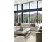 Open-concept living room with modern seating, large windows, hardwood floors and mountain views at 6601 E San Miguel Ave, Paradise Valley, AZ 85253