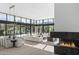 Open-concept living area with modern fireplace, dining table, and mountain views at 6601 E San Miguel Ave, Paradise Valley, AZ 85253