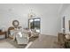 Spacious main bedroom featuring hardwood floors, mountain views, chandelier, and seating area at 6601 E San Miguel Ave, Paradise Valley, AZ 85253