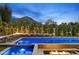 Inviting pool area featuring a modern design with fire accents and lush landscaping, creating a serene outdoor oasis at 6601 E San Miguel Ave, Paradise Valley, AZ 85253