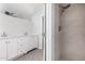 Bright bathroom with a double sink vanity and tiled walk-in shower at 6767 N 7Th St # 212, Phoenix, AZ 85014
