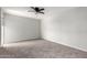 Spacious bedroom featuring neutral walls, carpet, and a ceiling fan for optimal comfort at 6767 N 7Th St # 212, Phoenix, AZ 85014
