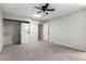 Bright bedroom includes a ceiling fan, and a convenient stackable washer and dryer at 6767 N 7Th St # 212, Phoenix, AZ 85014