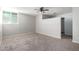 Large, carpeted bedroom with a ceiling fan and ample space for customization at 6767 N 7Th St # 212, Phoenix, AZ 85014