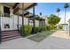 A landscaped building entrance with modern overhang and attractive walkway at 6767 N 7Th St # 212, Phoenix, AZ 85014