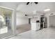 Kitchen area with appliances, countertops, and island open to living space with carpet at 6767 N 7Th St # 212, Phoenix, AZ 85014