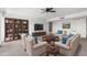 Living room displaying a comfortable seating arrangement, modern entertainment center, and ample natural light at 6767 N 7Th St # 212, Phoenix, AZ 85014