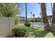 Community pool area with pool, landscaping and palm trees at 6767 N 7Th St # 223, Phoenix, AZ 85014