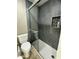 Modern bathroom featuring a glass-enclosed shower with tiled walls and a tiled inset at 7021 E Earll Dr # 223, Scottsdale, AZ 85251