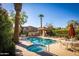 Enjoy the community pool and spa area with ample seating, shade, and lush landscaping at 7021 E Earll Dr # 223, Scottsdale, AZ 85251