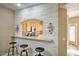 Stylish kitchen bar area featuring granite countertops, white stone accents, and seating at 7021 E Earll Dr # 223, Scottsdale, AZ 85251