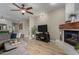 Spacious living room with a fireplace, modern furniture, and hardwood floors at 7021 E Earll Dr # 223, Scottsdale, AZ 85251