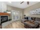 Cozy living area with fireplace, with doors leading to a patio at 7021 E Earll Dr # 223, Scottsdale, AZ 85251