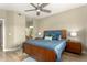 Comfortable primary bedroom featuring a ceiling fan and an ensuite bathroom at 7021 E Earll Dr # 223, Scottsdale, AZ 85251