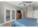 Bright main bedroom featuring access to a private patio, an ensuite bathroom, and ample closet space at 7021 E Earll Dr # 223, Scottsdale, AZ 85251