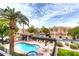 Community pool featuring comfortable lounge seating and lush landscaping at 7021 E Earll Dr # 223, Scottsdale, AZ 85251