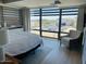 Bright bedroom featuring large windows with automated shades, a spacious closet, and city views at 7157 E Rancho Vista Dr # 5003, Scottsdale, AZ 85251