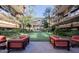 Courtyard showcasing an outdoor seating area, surrounded by well-manicured greenery and a putting green at 7157 E Rancho Vista Dr # 5003, Scottsdale, AZ 85251