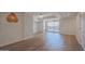 Spacious living room with modern lighting and wood flooring with balcony access at 7157 E Rancho Vista Dr # 5003, Scottsdale, AZ 85251