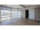 Bright living room with hardwood floors and a large window with vertical blinds for natural light at 7157 E Rancho Vista Dr # 5003, Scottsdale, AZ 85251