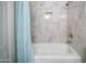 Modern bathroom showcasing a clean tub with a built-in niche and shower at 7928 N 46Th Ave, Glendale, AZ 85301