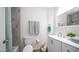 Bright bathroom with fresh white vanity and modern gray and white accents at 7928 N 46Th Ave, Glendale, AZ 85301