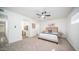 This bedroom offers a ceiling fan and an ensuite bathroom for convenience at 7928 N 46Th Ave, Glendale, AZ 85301