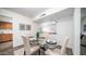 Elegant dining area with a glass table set, complemented by chic chairs and tasteful decor at 7928 N 46Th Ave, Glendale, AZ 85301