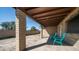 Covered patio featuring textured columns, flagstone and views of the backyard at 7928 N 46Th Ave, Glendale, AZ 85301