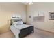 Vaulted ceiling bedroom with a large window and carpeted floors offers a tranquil and bright space at 804 N Jamaica Way, Gilbert, AZ 85234