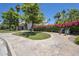 Beautiful clubhouse with a charming entrance, lush landscaping, and inviting walking paths at 804 N Jamaica Way, Gilbert, AZ 85234