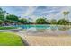 Gorgeous community pool with trees, and lake view is a resort like retreat at 804 N Jamaica Way, Gilbert, AZ 85234